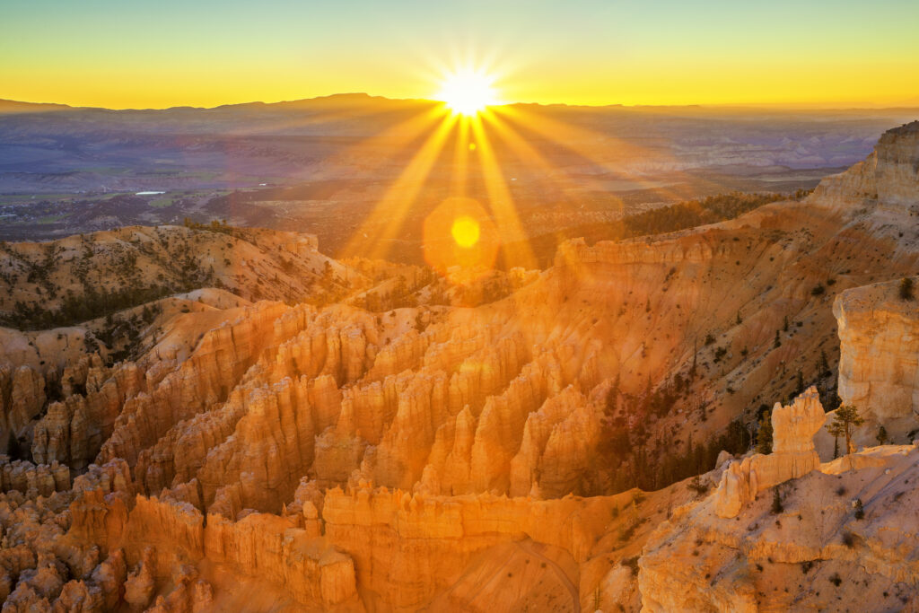best places to watch sunrise showing golden light over water at dawn representing the world's most breathtaking sunrise spots