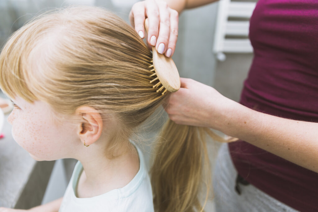 how to french braid showing step by step hand positions for creating a French braid representing an easy beginner tutorial for braiding hair