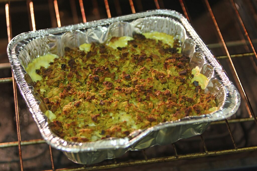 how to reheat french fries in the oven showing leftover french fries on a baking sheet representing how to reheat french fries without making them soggy using oven air fryer and skillet methods