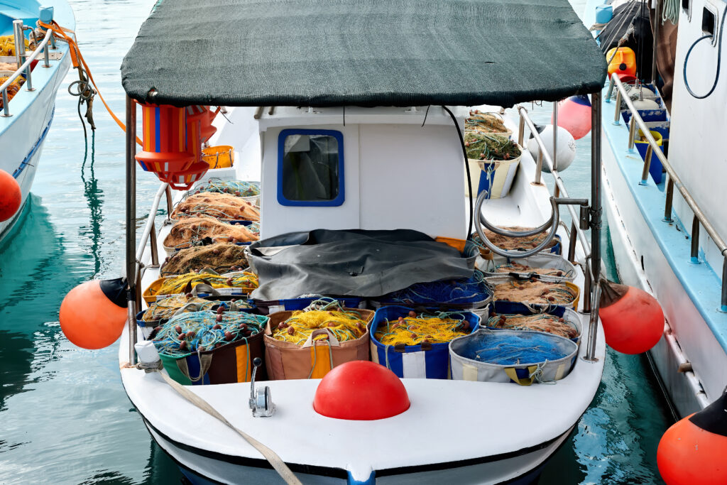 best boat fishing accessories showing fishing boat with trolling motor rod holders and fish finder representing top boat accessories buyer's guide 2026