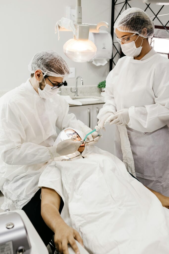 how long does dental numbing last showing patient touching cheek after dental procedure with numbness still present