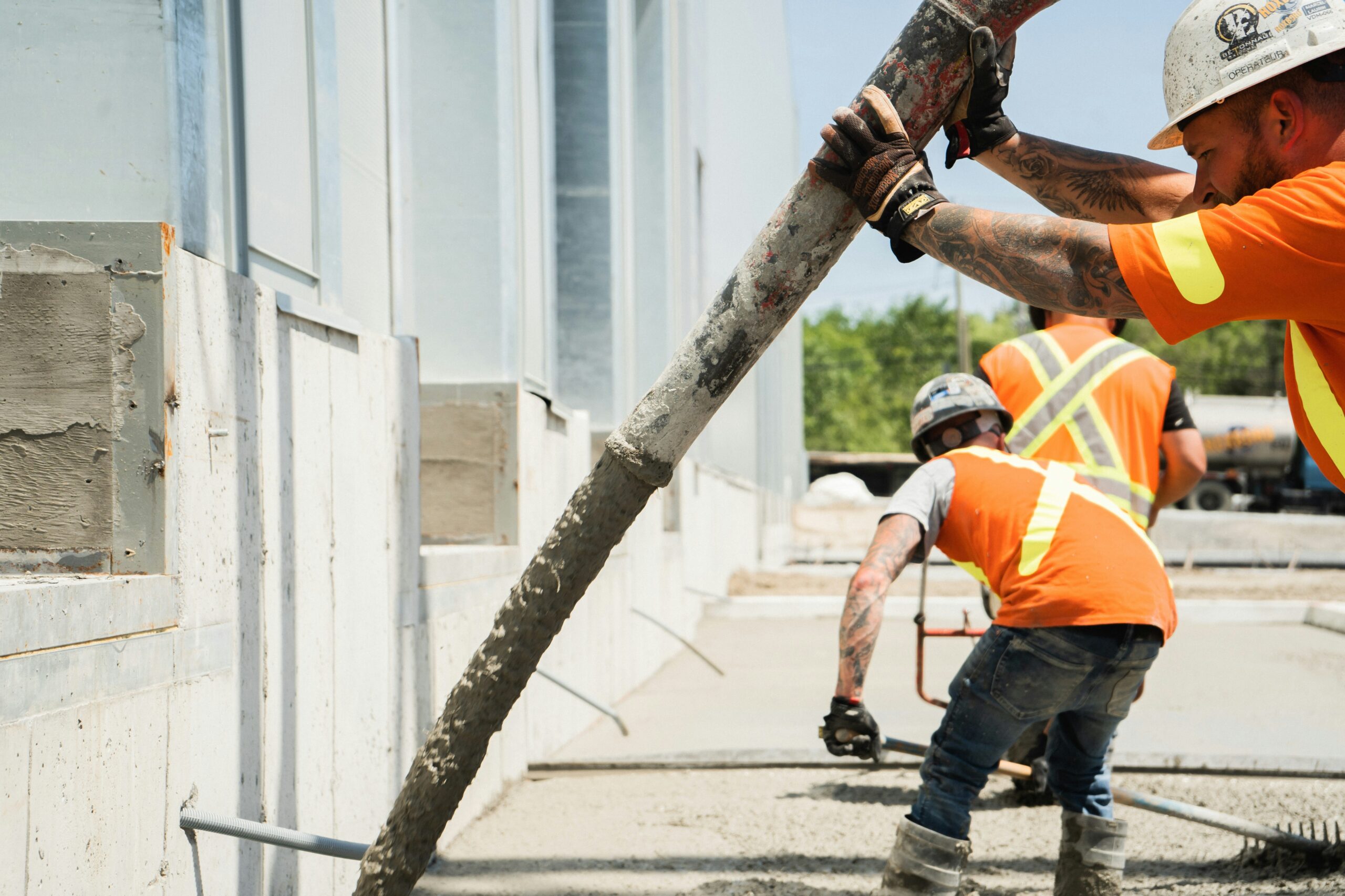 how long does concrete take to dry showing a freshly poured concrete patio slab curing in a backyard representing the drying and curing timeline for driveways patios and walkways