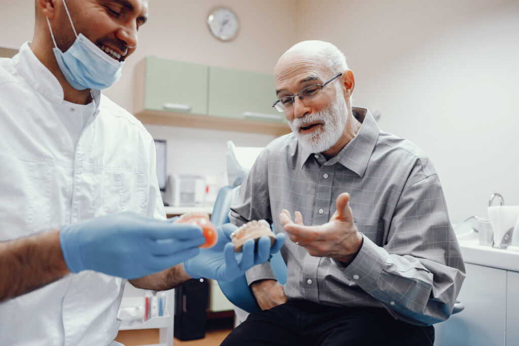 best dental implants brands 2026 showing titanium implant components with crown and abutment labeled