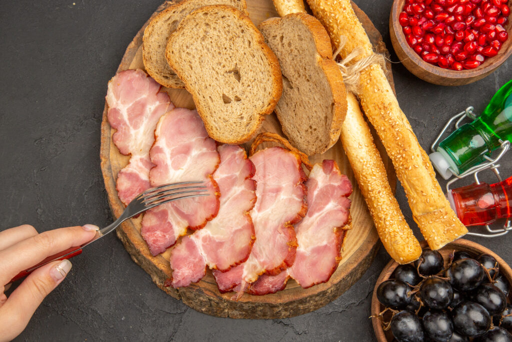 pancetta vs guanciale vs bacon side by side comparison showing the three cured pork products with different textures and colors representing the key differences between Italian cured meats and American bacon