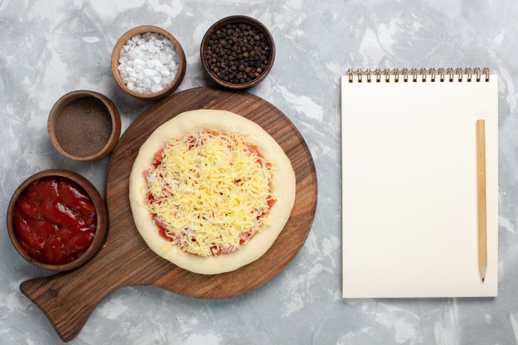 little caesars pizza dough recipe showing homemade pizza dough on a floured surface representing Little Caesars copycat recipes pizza dough Italian cheese bread garlic butter sauce crazy bread and pizza puffs