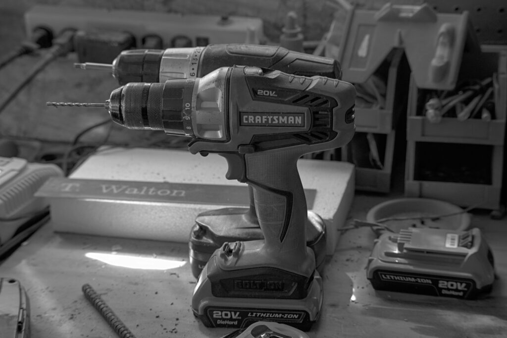 hammer drill vs impact driver showing a hammer drill and impact driver side by side representing the difference between hammer drill vs impact driver and when to use each type of drill